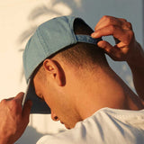 Model wearing, cap seen from back