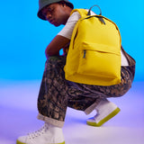 Yellow backpack on man's shoulder