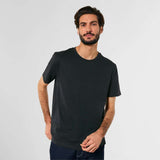 Rocker Unisex T-Shirt in black made from 100% organic cotton, featuring a relaxed fit and minimalist design. Sustainable apparel for everyday wear.