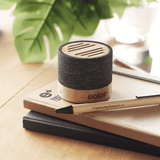 wireless bamboo speaker with wood pencil and notebook