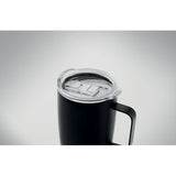 Black tumbler with grey background
